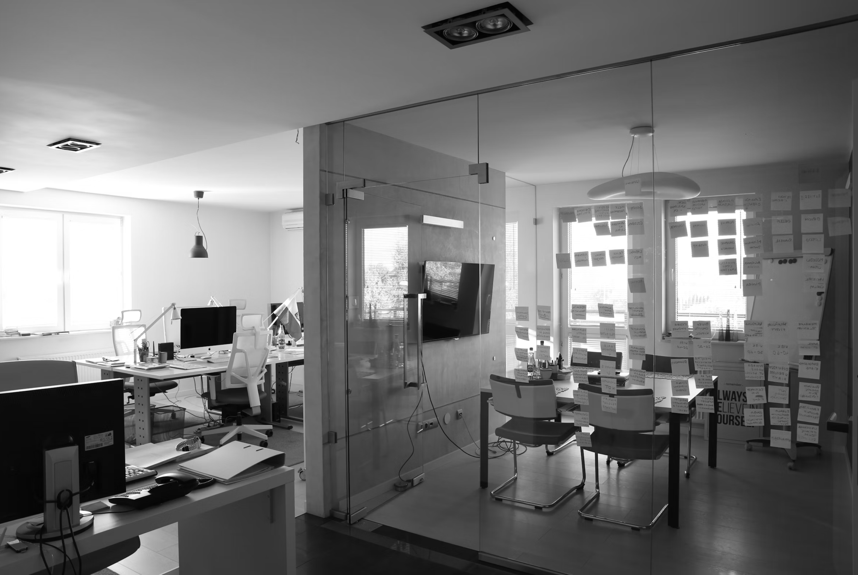 Photo of a study hall area with desks and people studying.